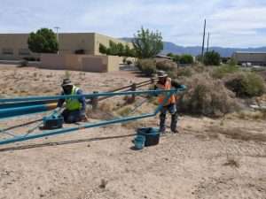 Crew painting gates